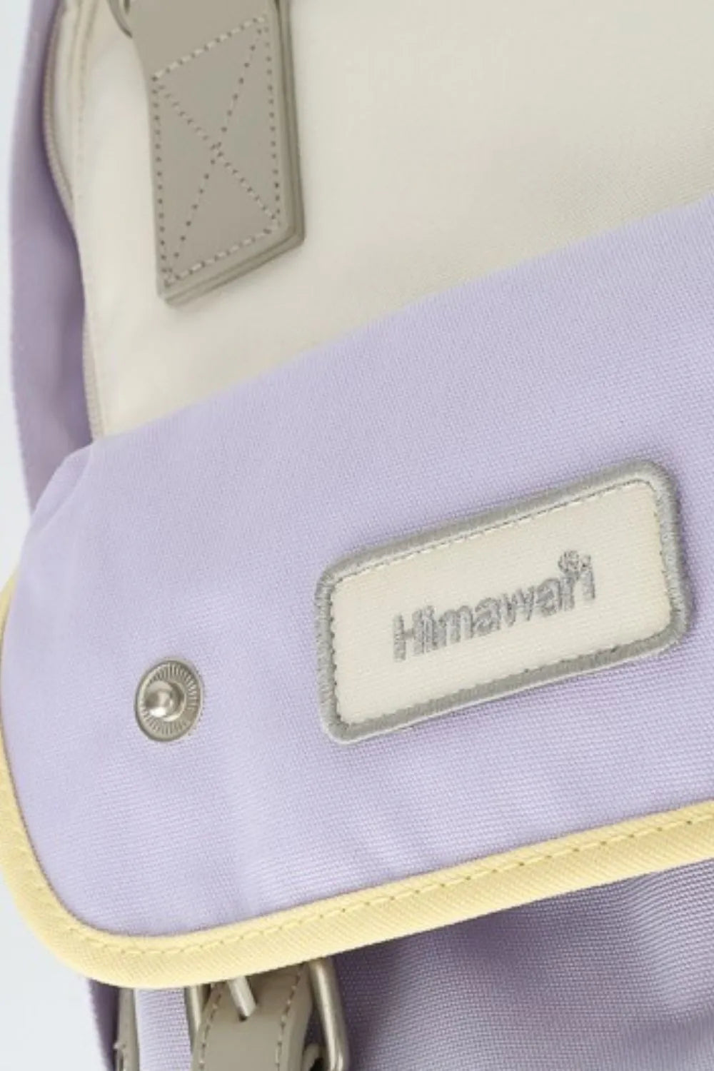 Himawari water-resistant nylon backpack in purple and white with contrast trim.