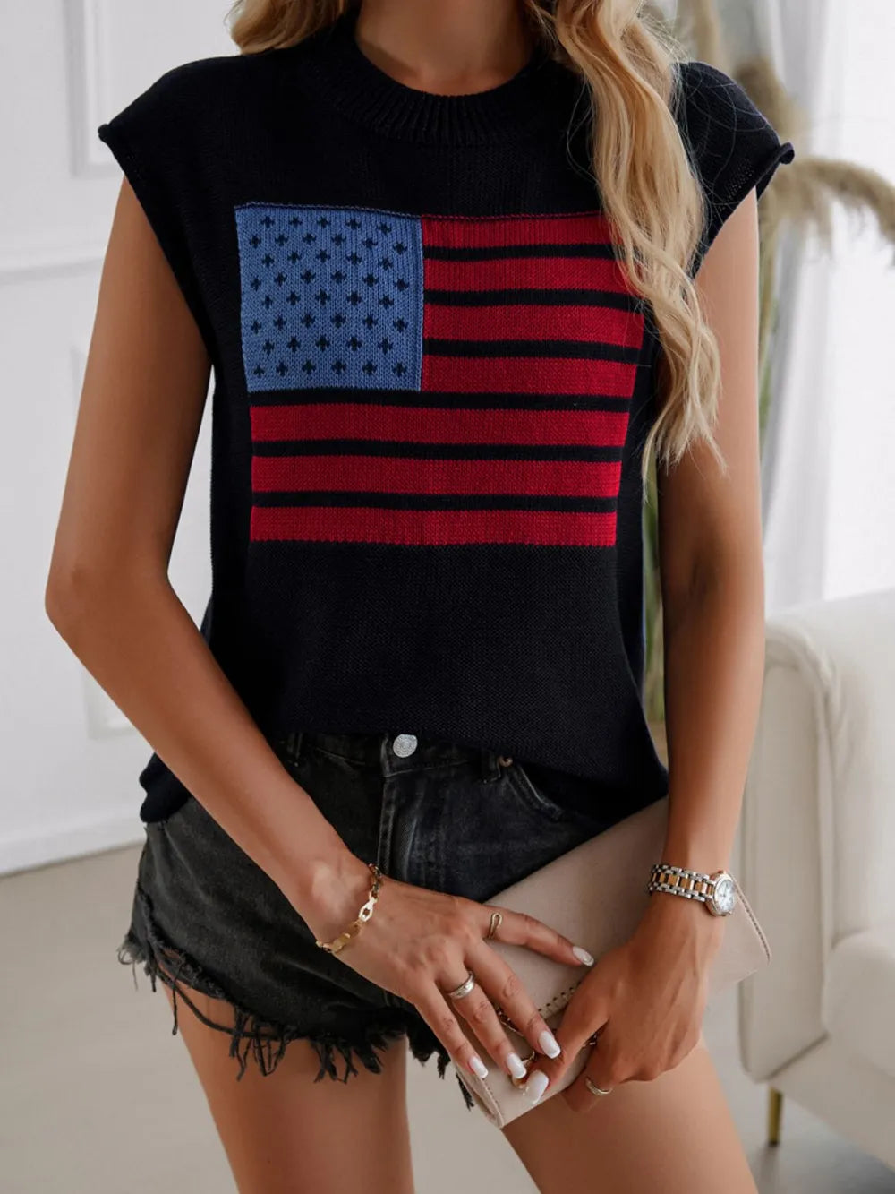 Red, white, and blue US flag sweater vest with round neck and moderate stretch.