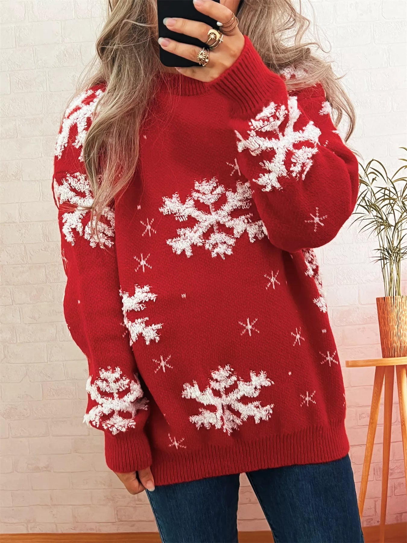 Light gray long sleeve sweater with ribbed hem, made of 100% polyester.