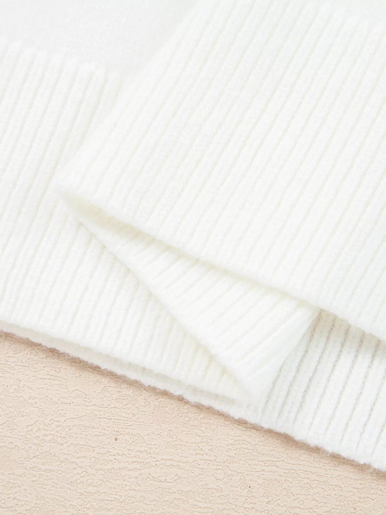 Soft viscose blend raglan sleeve sweater with relaxed fit and subtle poodle motif for holidays