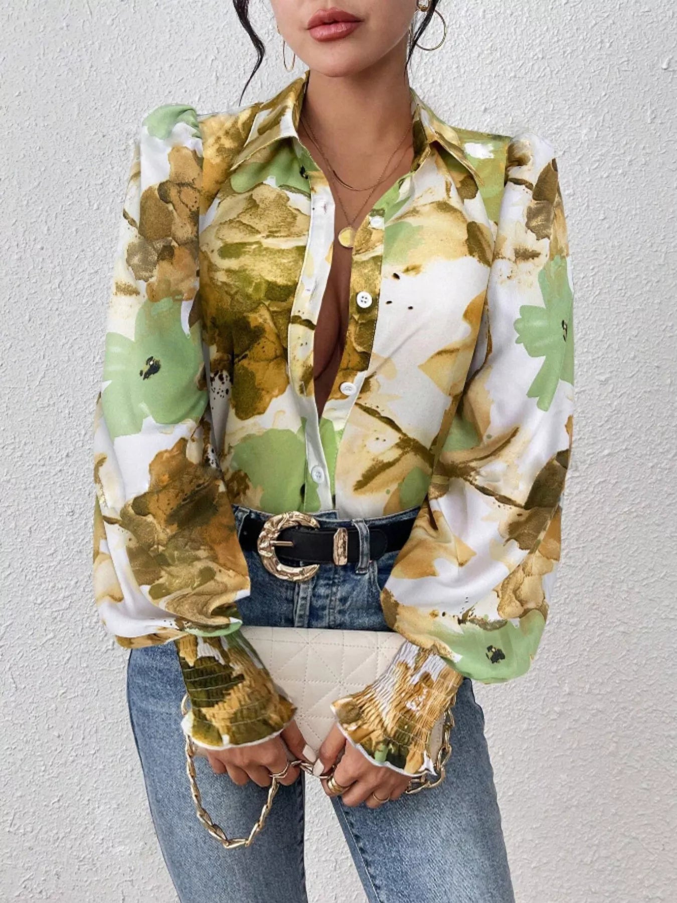 Printed button-up shirt with lantern sleeves in a polyester blend fabric.