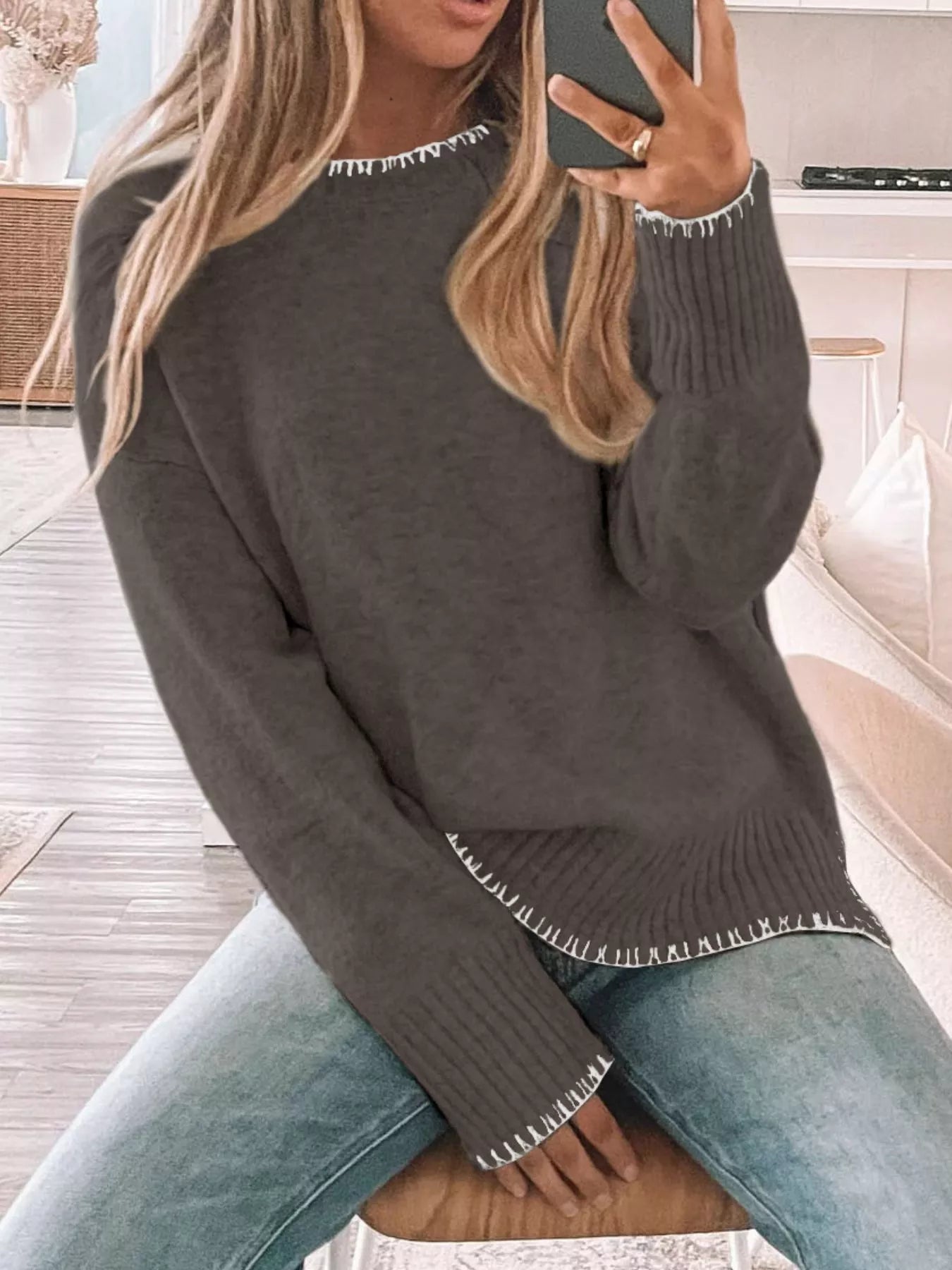 Trendsi round neck sweater with slit and contrast trim in a viscose blend fabric.