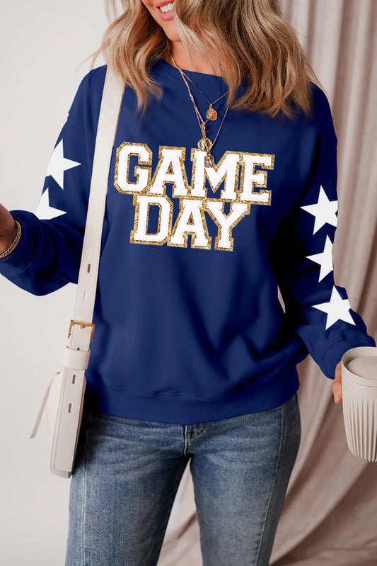 Long sleeve cotton blend sweatshirt with glitter star design and opaque fabric.