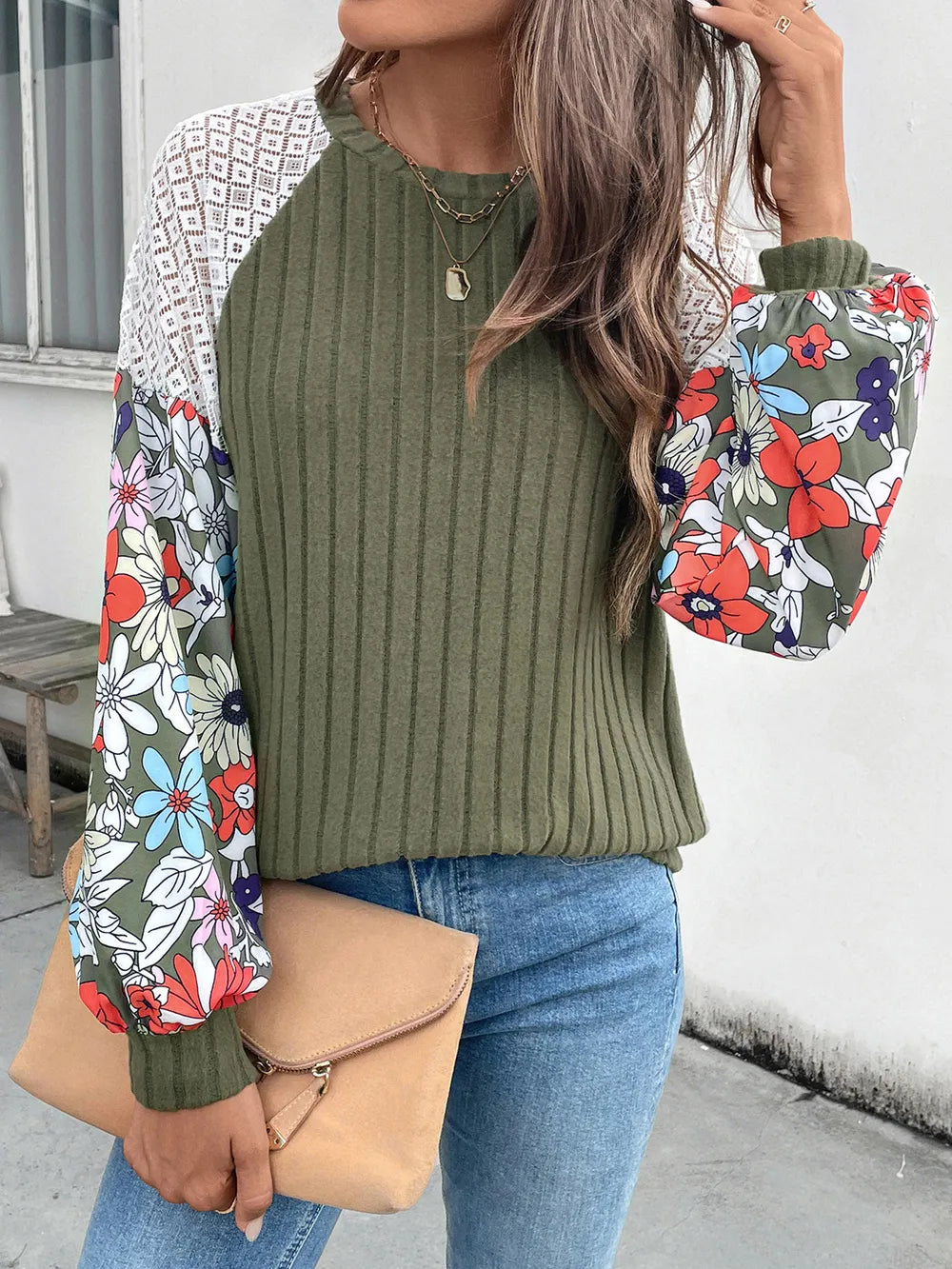 Long sleeve round neck knit top in a polyester blend with moderate stretch.