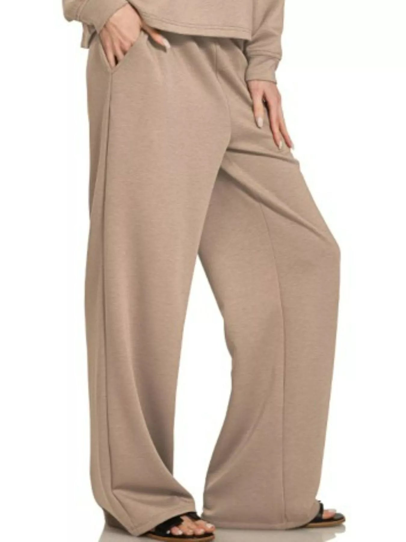 Woman modeling cocoa-colored oversized crewneck sweatshirt and wide-leg palazzo pants set.
