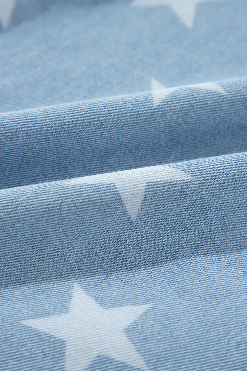 Raw hem denim top with a star collar in a cotton blend fabric.