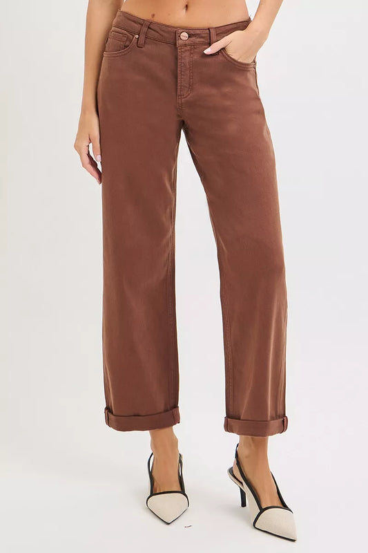 Brown wide-leg high-rise jeans with cuffed hems on a plus-size model.