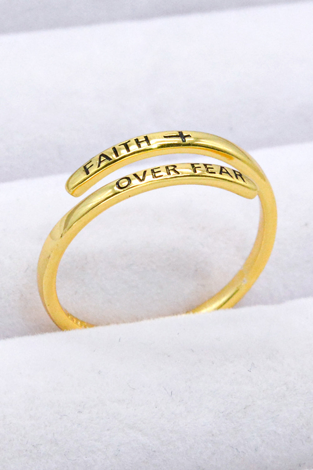 Gold-plated sterling silver bypass ring engraved with "Faith Over Fear" and a cross.