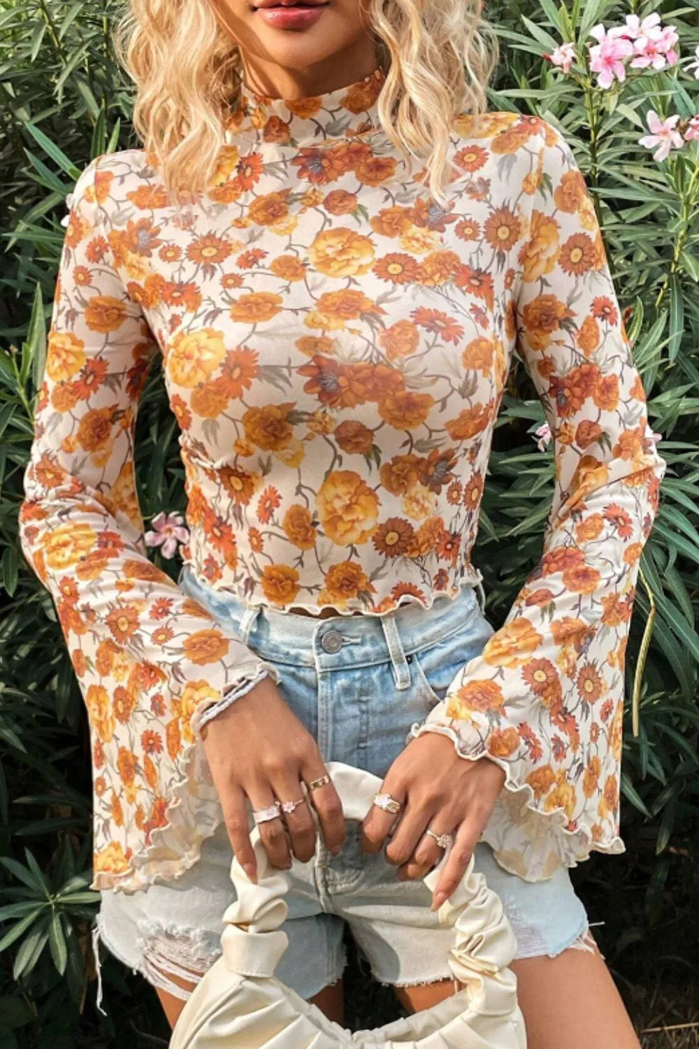 Flare sleeve mock neck top in slightly stretchy polyester with an elegant printed design.
