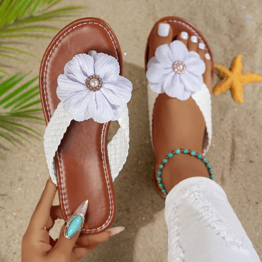 Bohemian brown leather toe post sandals with white flower accent and turquoise beads.