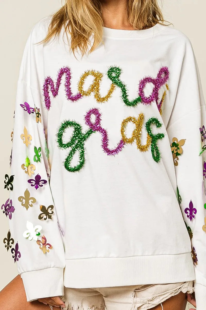 Fleur De Lis Sleeve Pullover with intricate sleeve designs in soft-washed fabric.