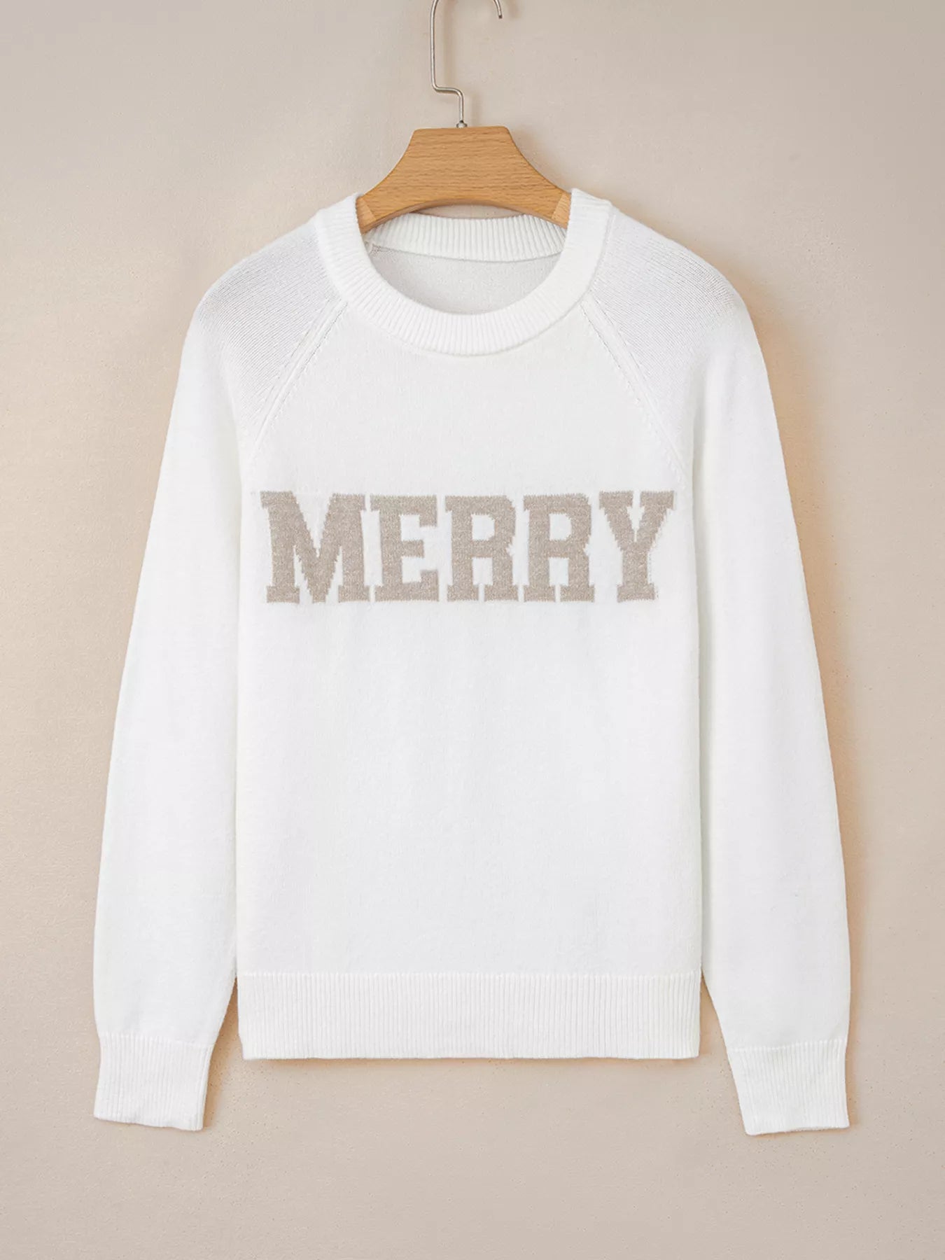 Soft viscose blend raglan sleeve sweater with relaxed fit and subtle poodle motif for Christmas.