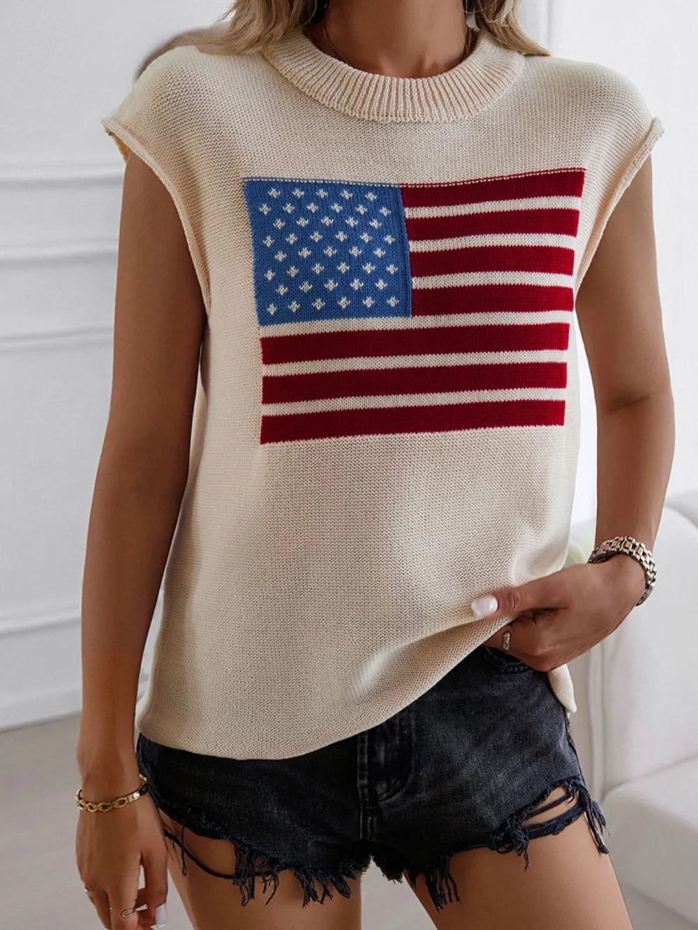 Red, white, and blue US flag sweater vest with round neck and moderate stretch.
