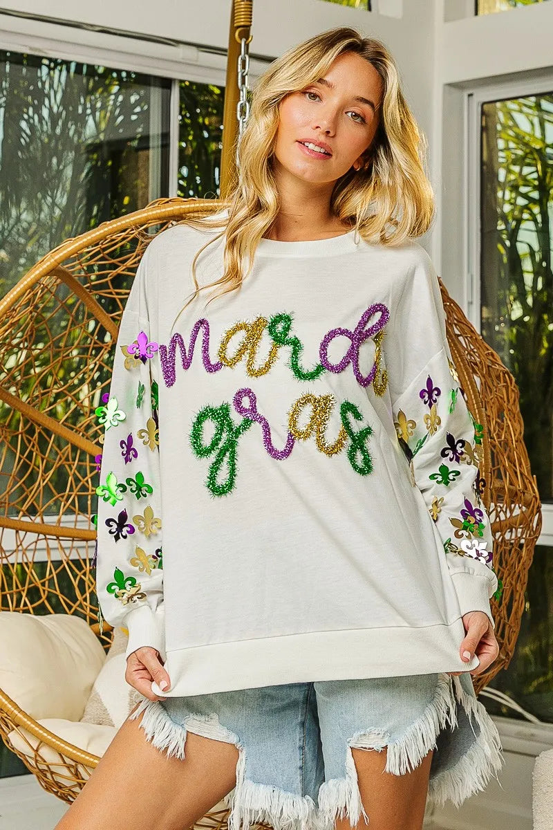 Lightweight pullover with Fleur De Lis sleeve designs in soft-washed fabric for comfort.