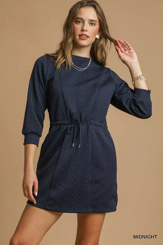 Navy cable knit mini dress with drawstring waist and pockets.