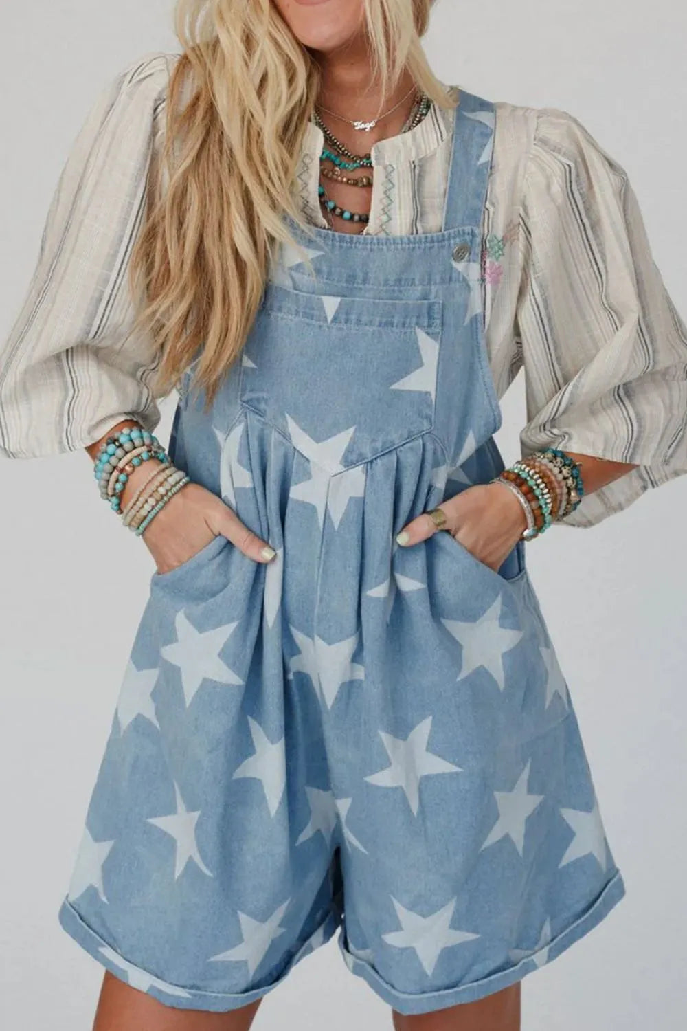 Denim overalls with a star print, square neck, and pocketed design in a cotton blend.