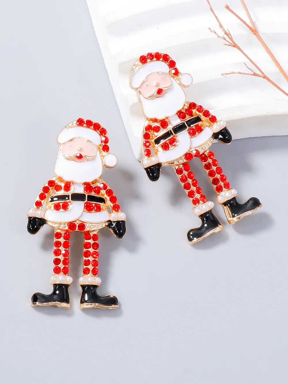 Pair of alloy Santa Claus earrings with red rhinestones and white accents.