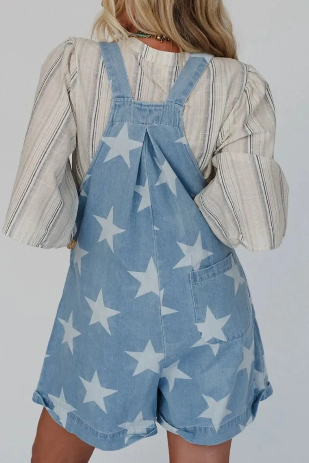 Denim overalls with star print, square neck, cotton blend fabric, and front pockets.
