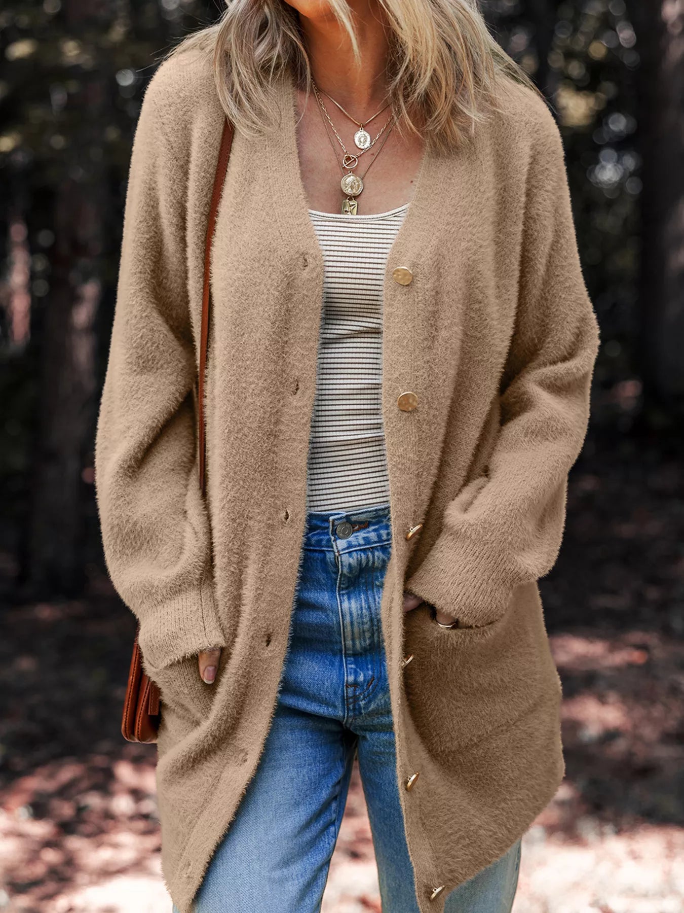 Fuzzy buttoned cardigan in a viscose blend with pockets, ideal for fall layering.