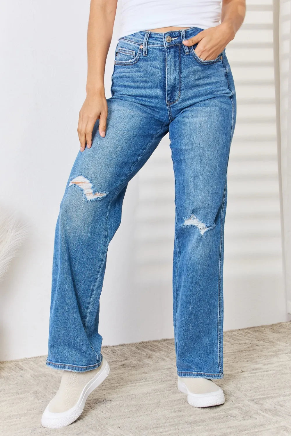 Model wearing Judy Blue high-waist distressed straight-leg jeans.