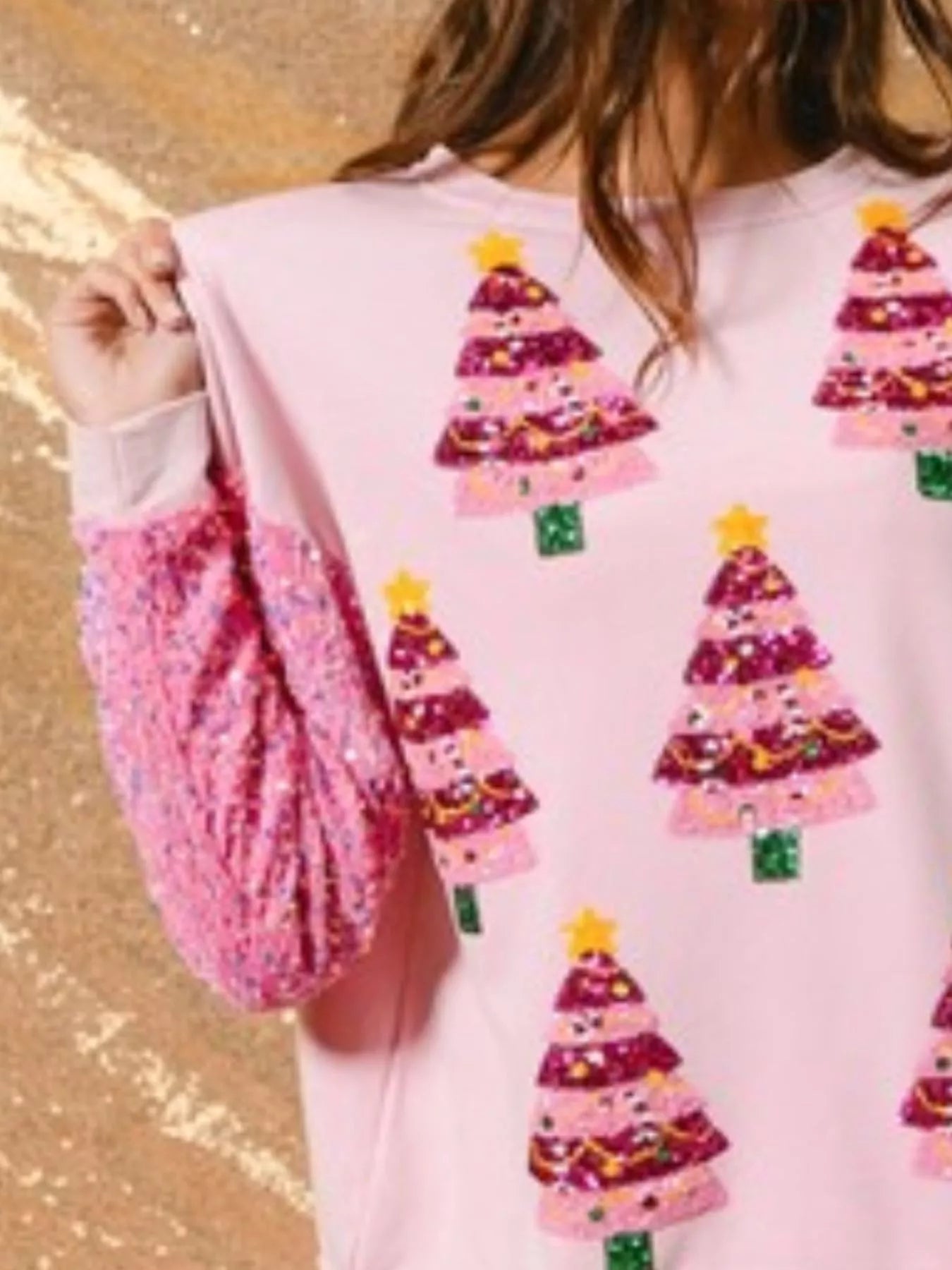 Long sleeve sweatshirt with subtle sequins and a comfortable fit for holiday wear