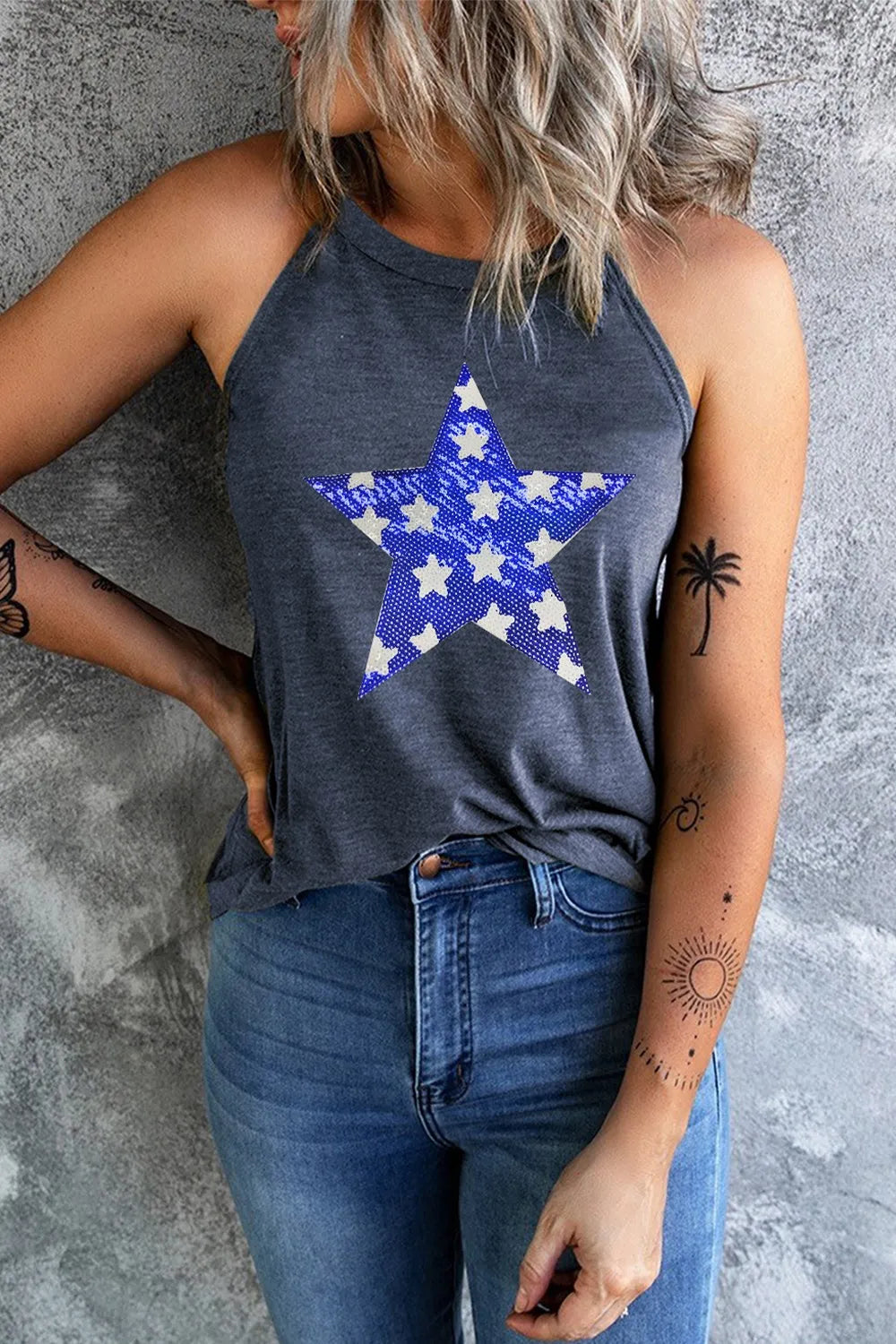 Sheer stretch tank top with sequin star design and Grecian neckline in various sizes.
