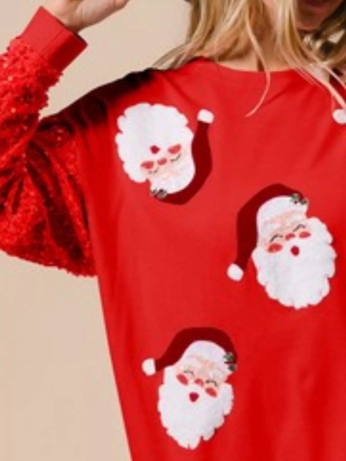 Long sleeve sweatshirt with delicate sequins and a comfortable fit for holiday wear.