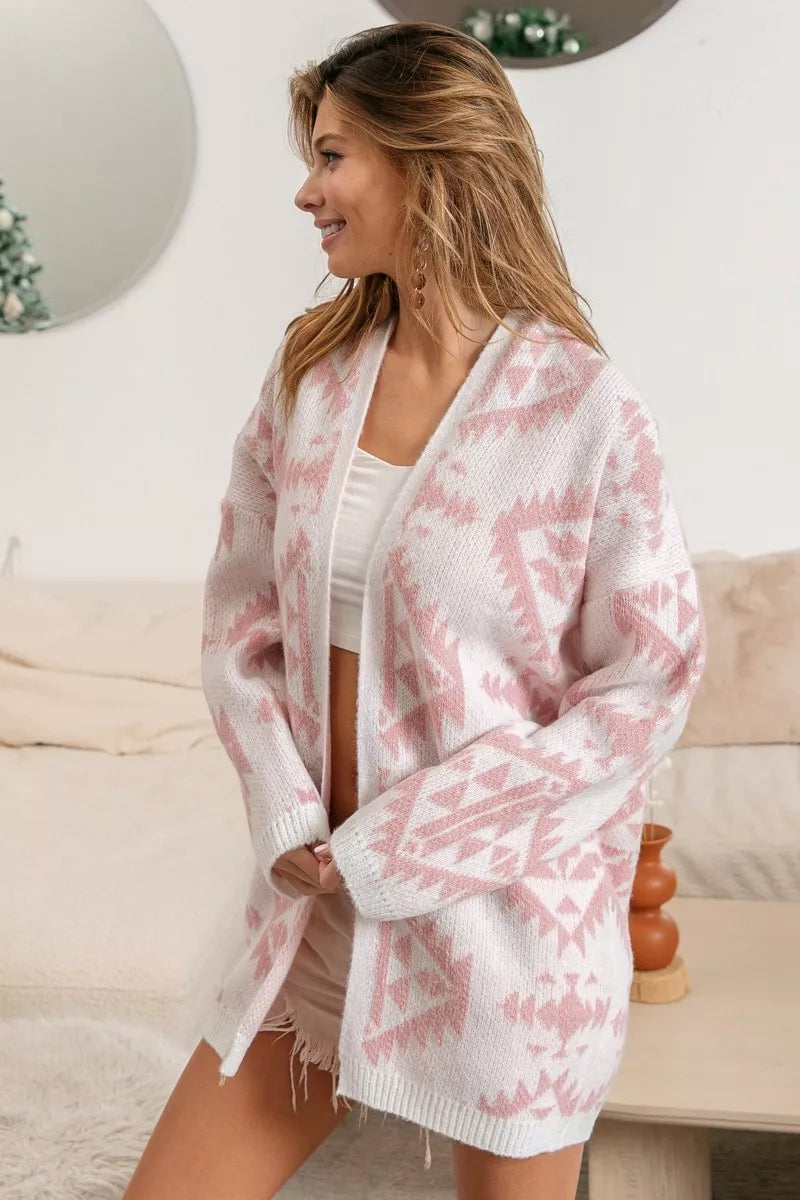 Pink acrylic open-front cardigan with Aztec pattern, modeled on a woman.