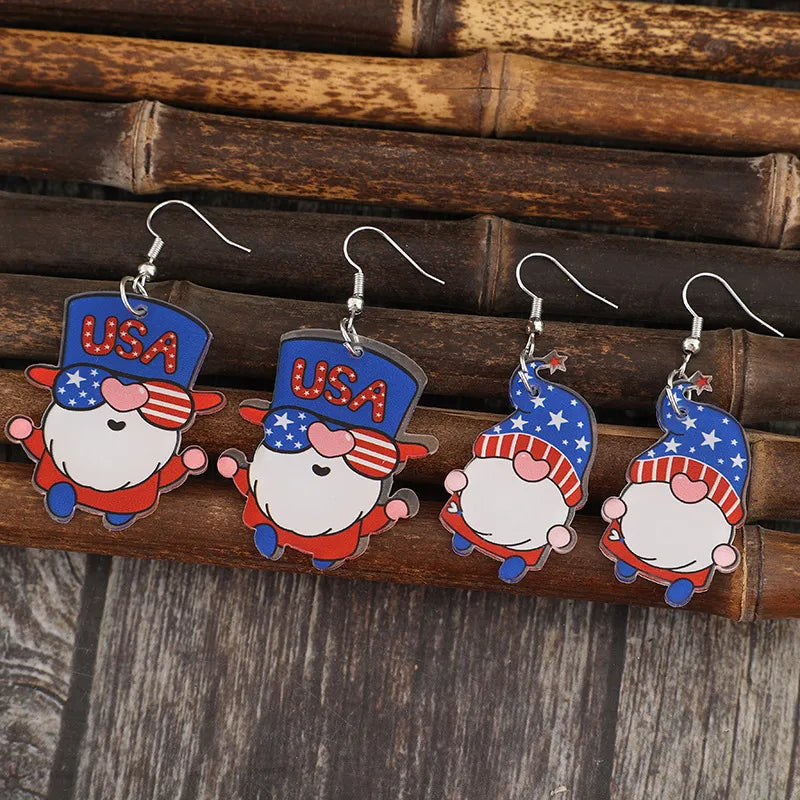 Two pairs of acrylic gnome earrings with alloy accents, 2.4 inches long.