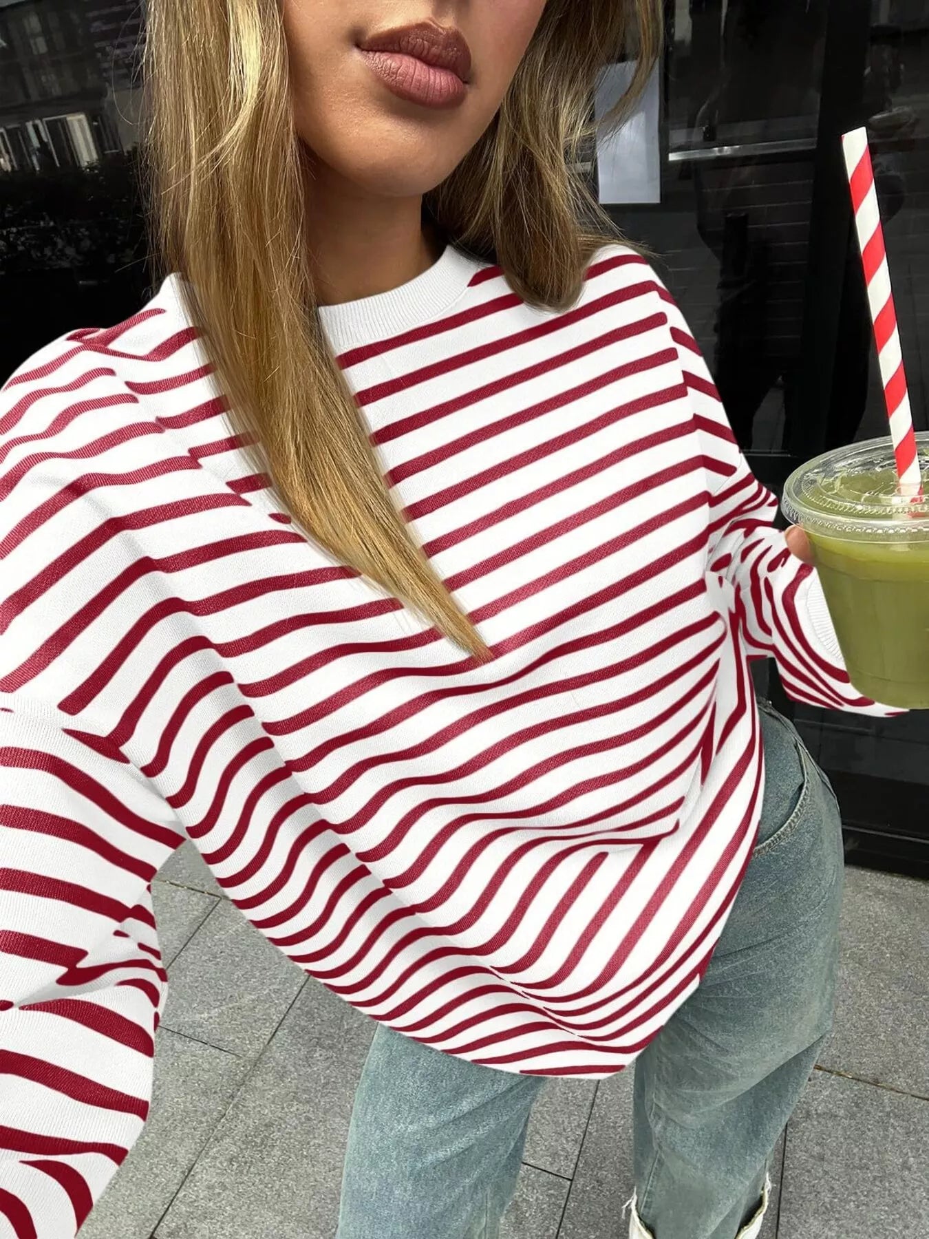 Oversized striped sweatshirt in a rayon blend with slight stretch and casual style.