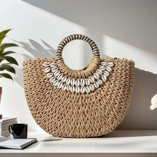 Small woven straw handbag embellished with seashells, measuring 7.9 inches high and 11.8 inches long.