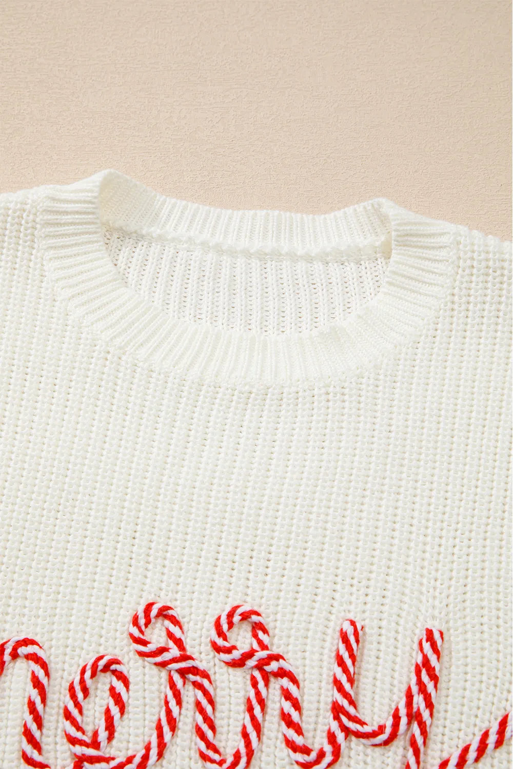 Cream acrylic cotton round neck sweater with red "Merry & Bright" embroidery.