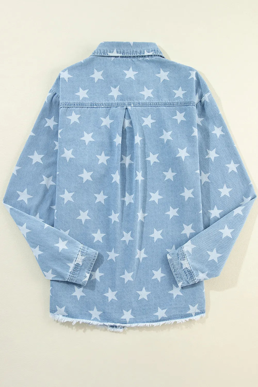 Denim top with a raw hem and star collar, made from a cotton blend.