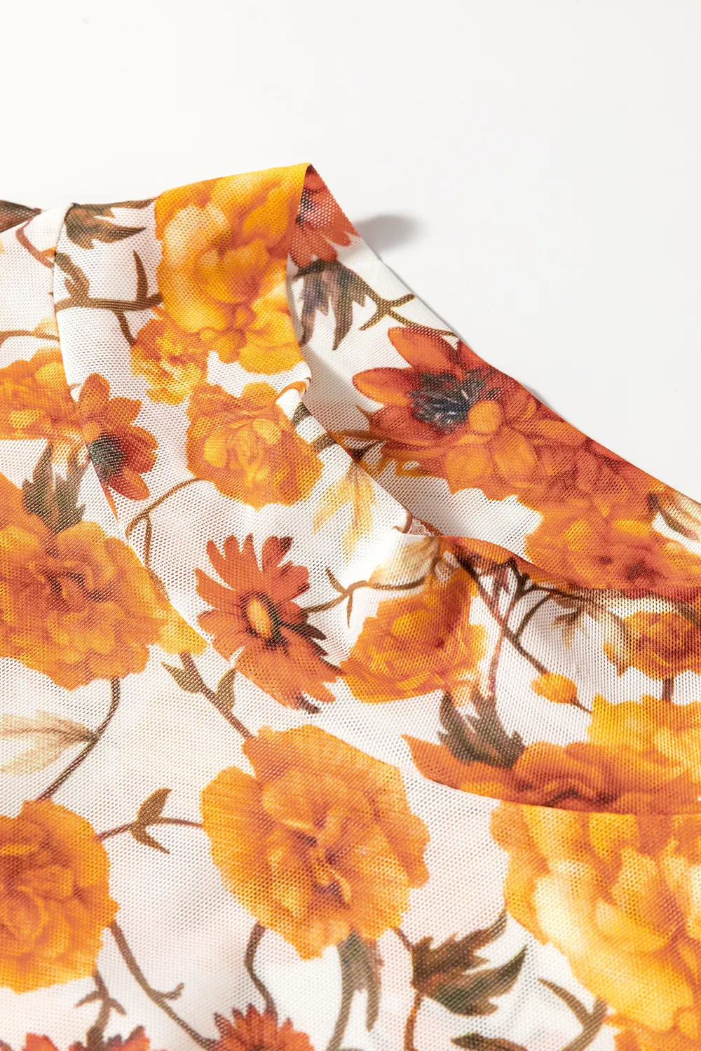 Flare sleeve mock neck top in slightly stretchy polyester with a printed design.