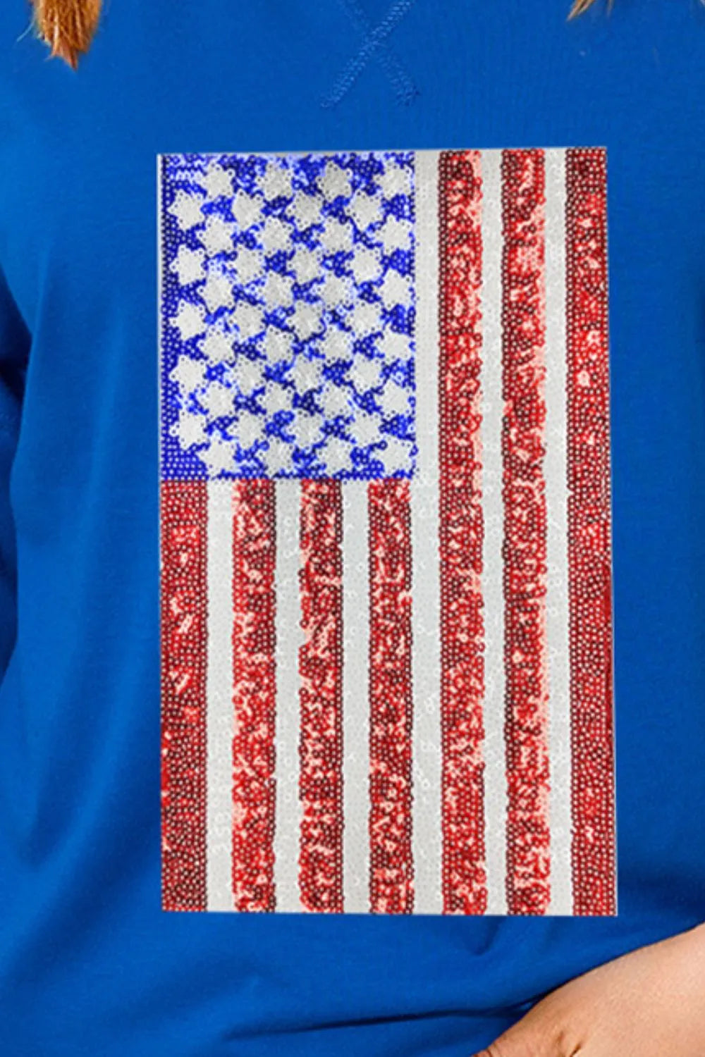 White t-shirt with US flag design, round neck, and half sleeves made of cotton blend.