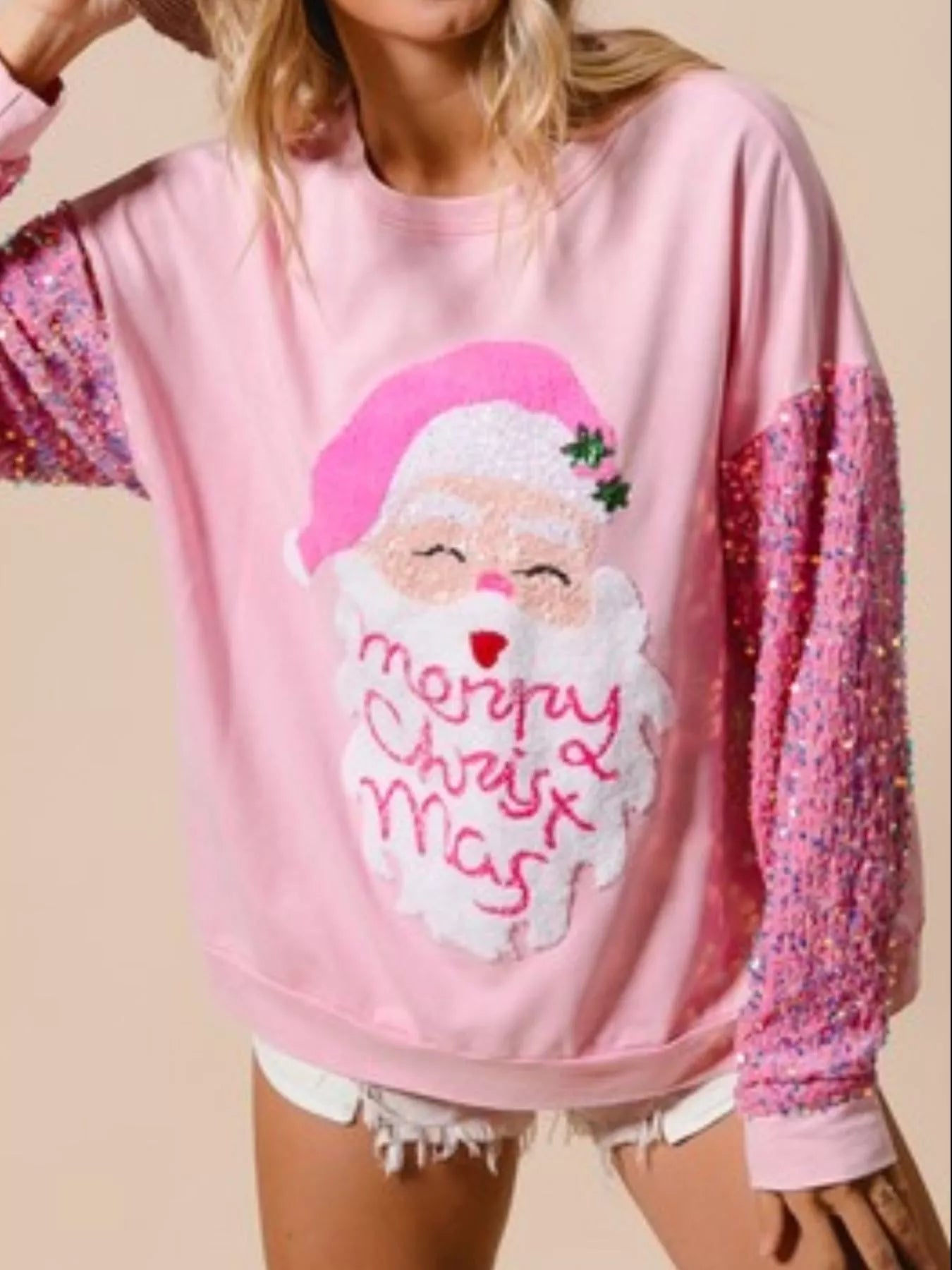 Long sleeve sweatshirt with sequins, featuring a comfortable fit and festive shimmer.