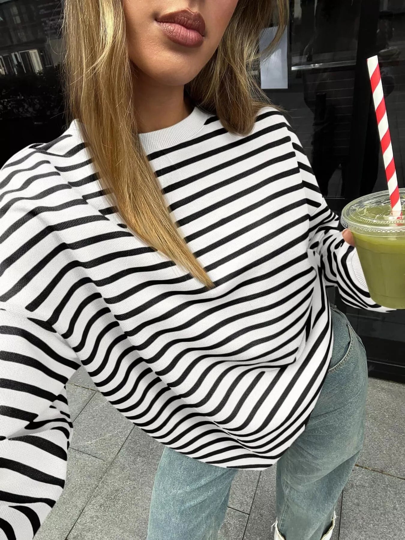 Oversized striped sweatshirt in a rayon blend, featuring a casual style and slight stretch.
