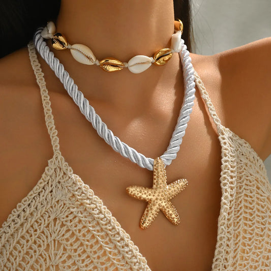 Two-piece gold-tone boho necklace set with shell beads, rope chain, and starfish pendant.
