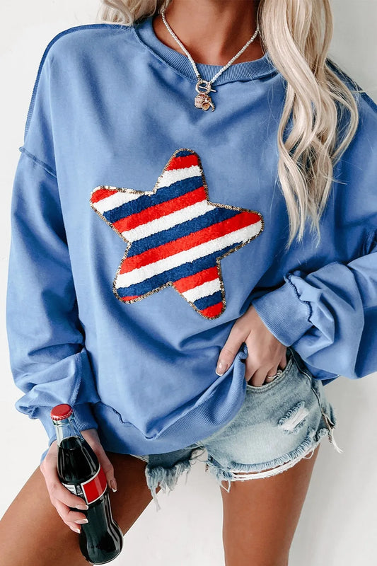A cotton blend long sleeve sweatshirt with exposed seams and a star design.