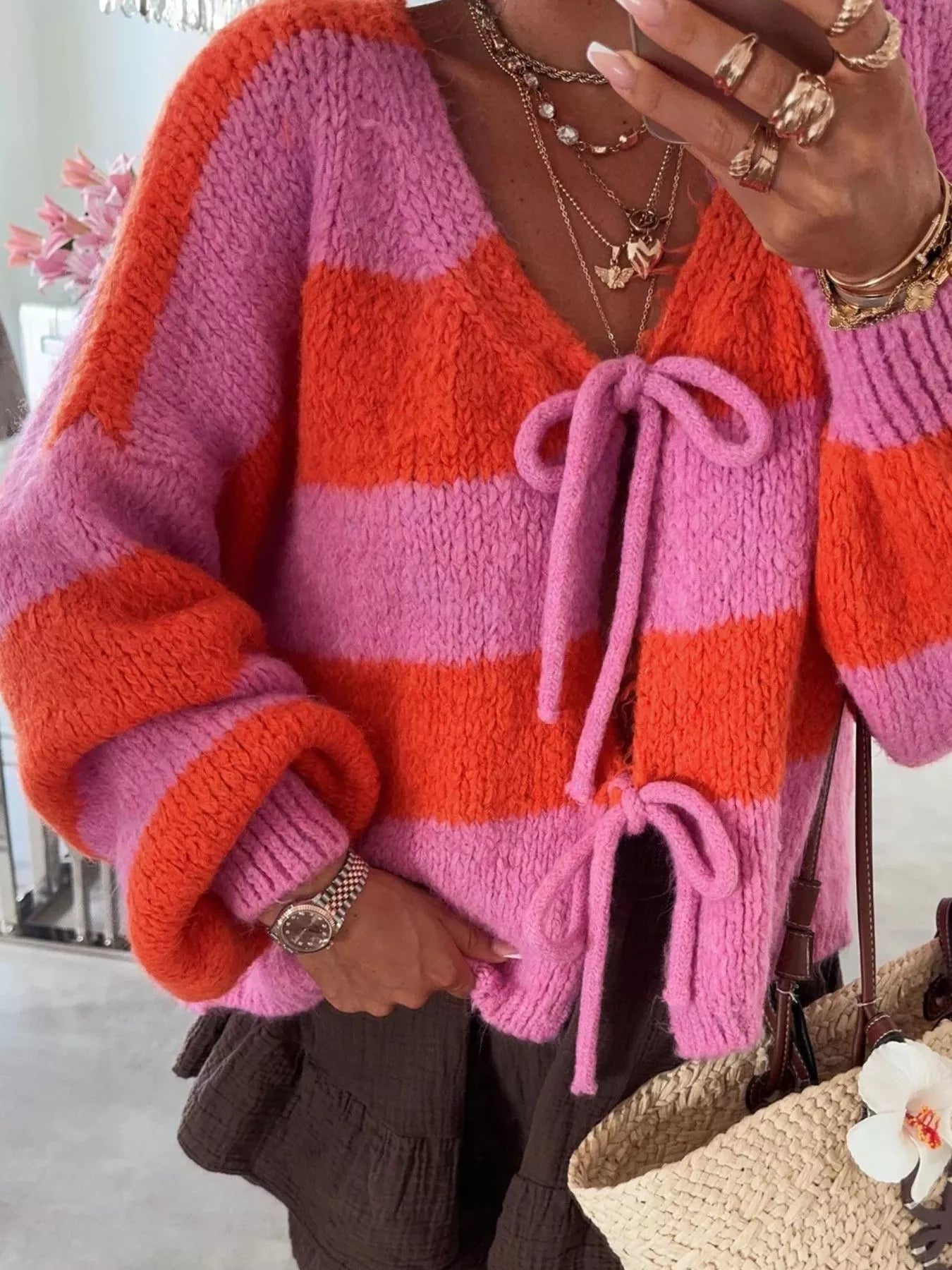 Striped knit cardigan with tie-front detail and slightly stretchy fabric in neutral tones