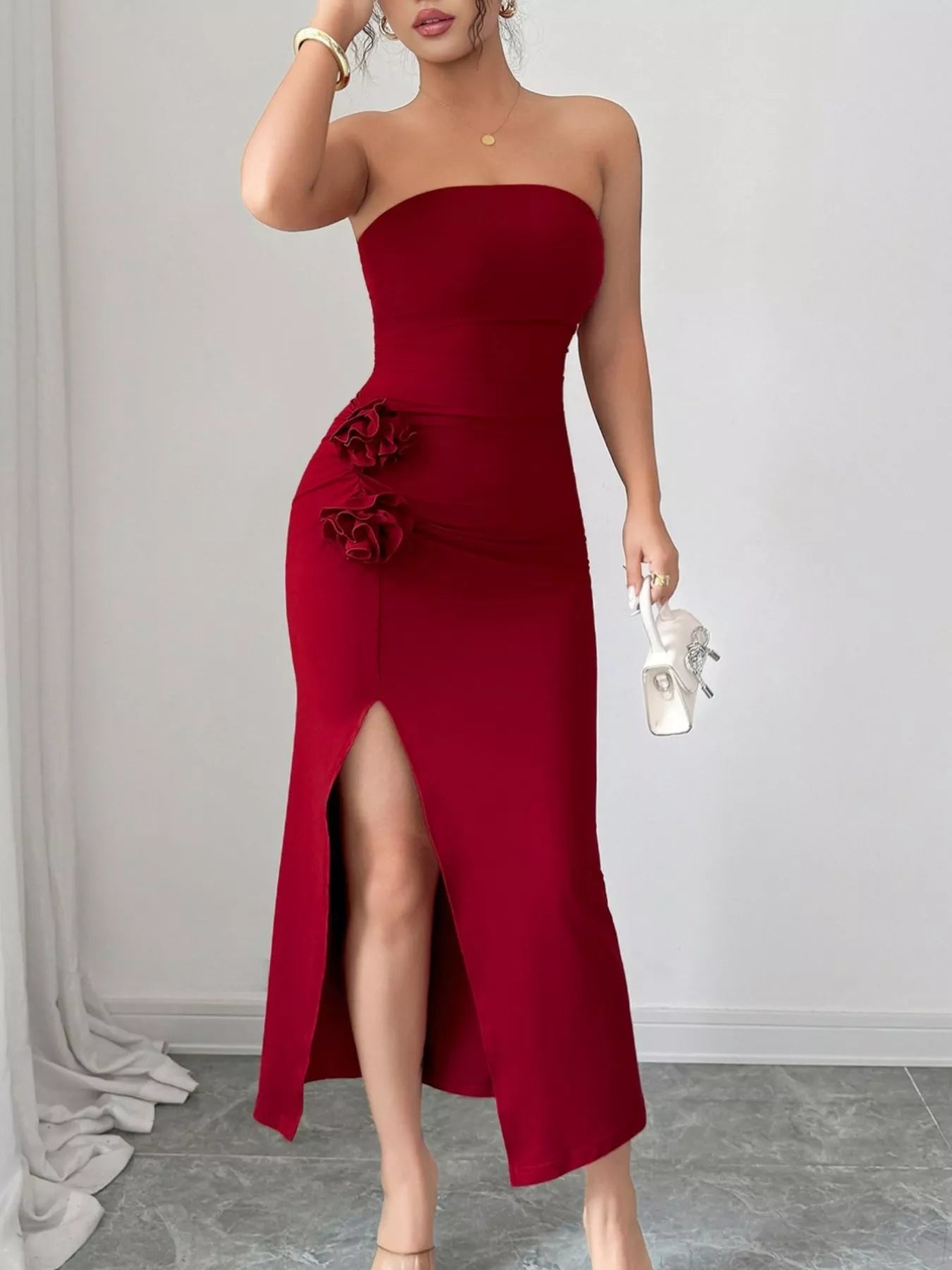 Navy blue strapless dress with front split and floral detail, ideal for garden parties.