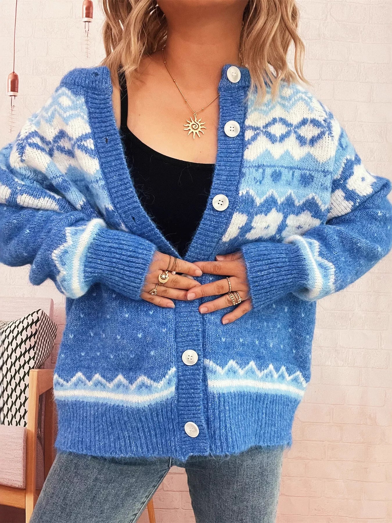 Ribbed knit cardigan with buttons in black polyester stretch fabric and long sleeves.