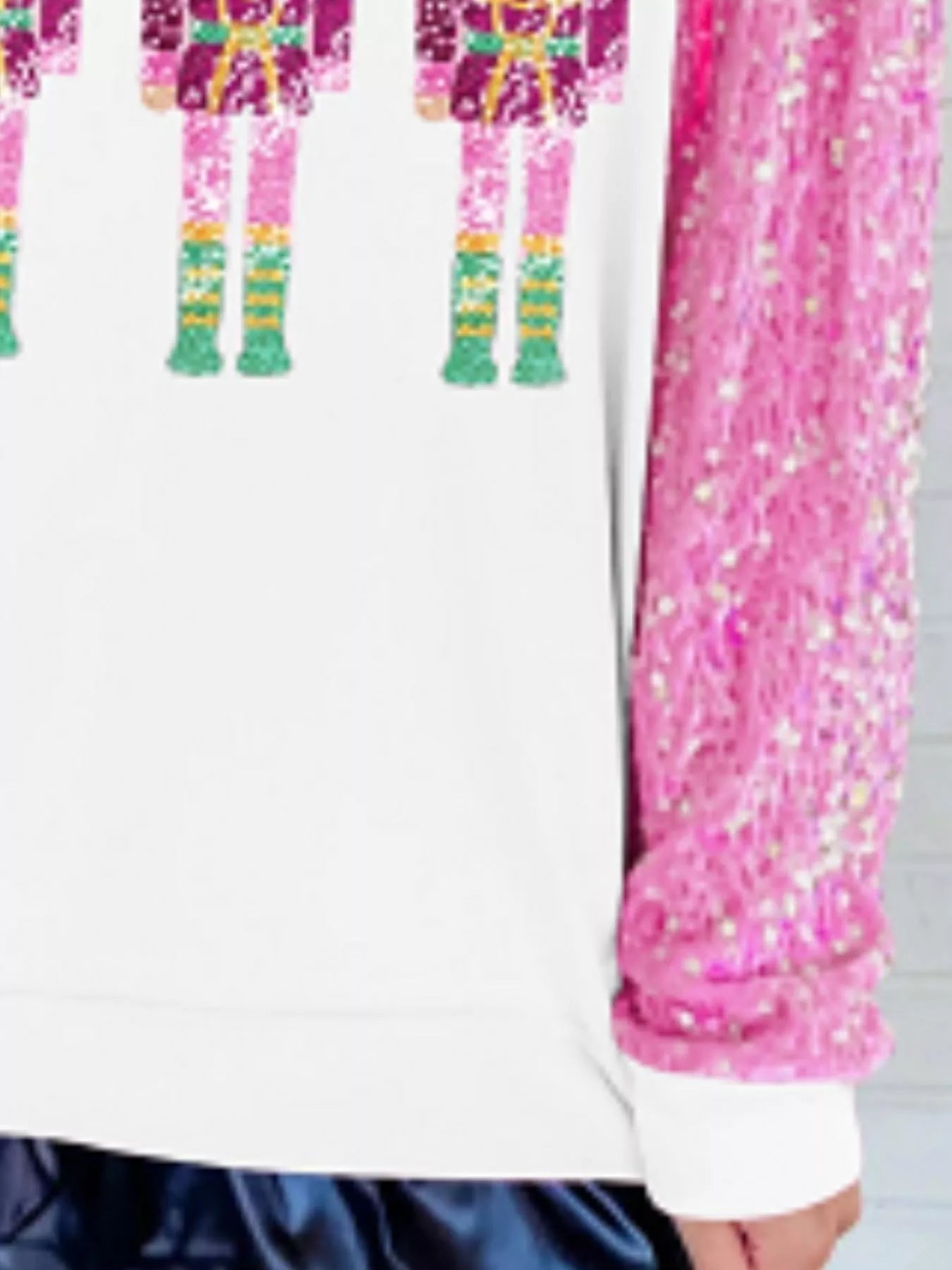 Sequin long sleeve sweatshirt with subtle sparkle and comfortable fit in festive style