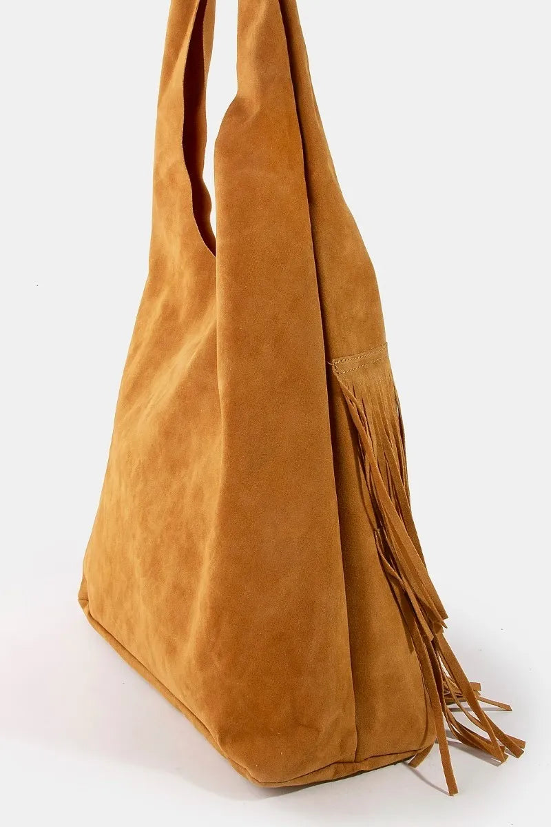 Caramel suede hobo bag with fringe detail and wide shoulder strap.