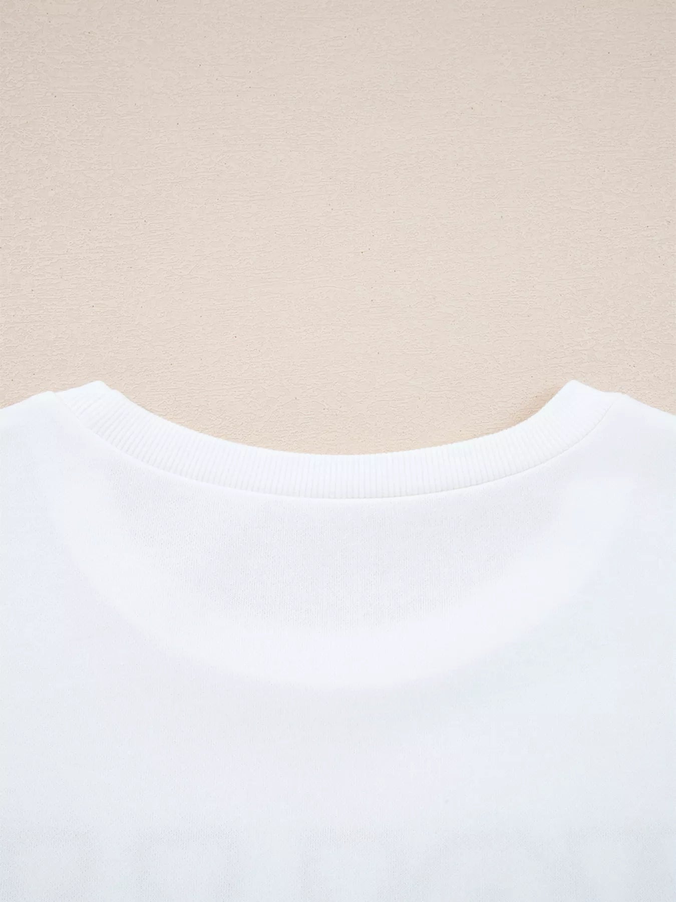 Round neck sweatshirt with Holly Jolly embroidery in polyester cotton blend fabric.