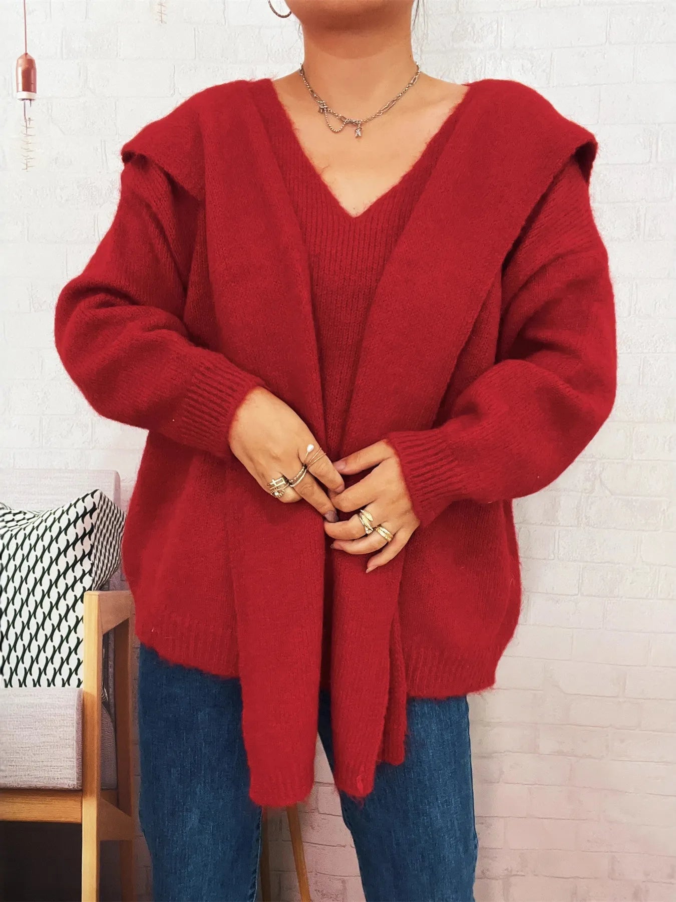Ribbed hem V-neck sweater with shawl, slightly stretchy, in soft polyester fabric.