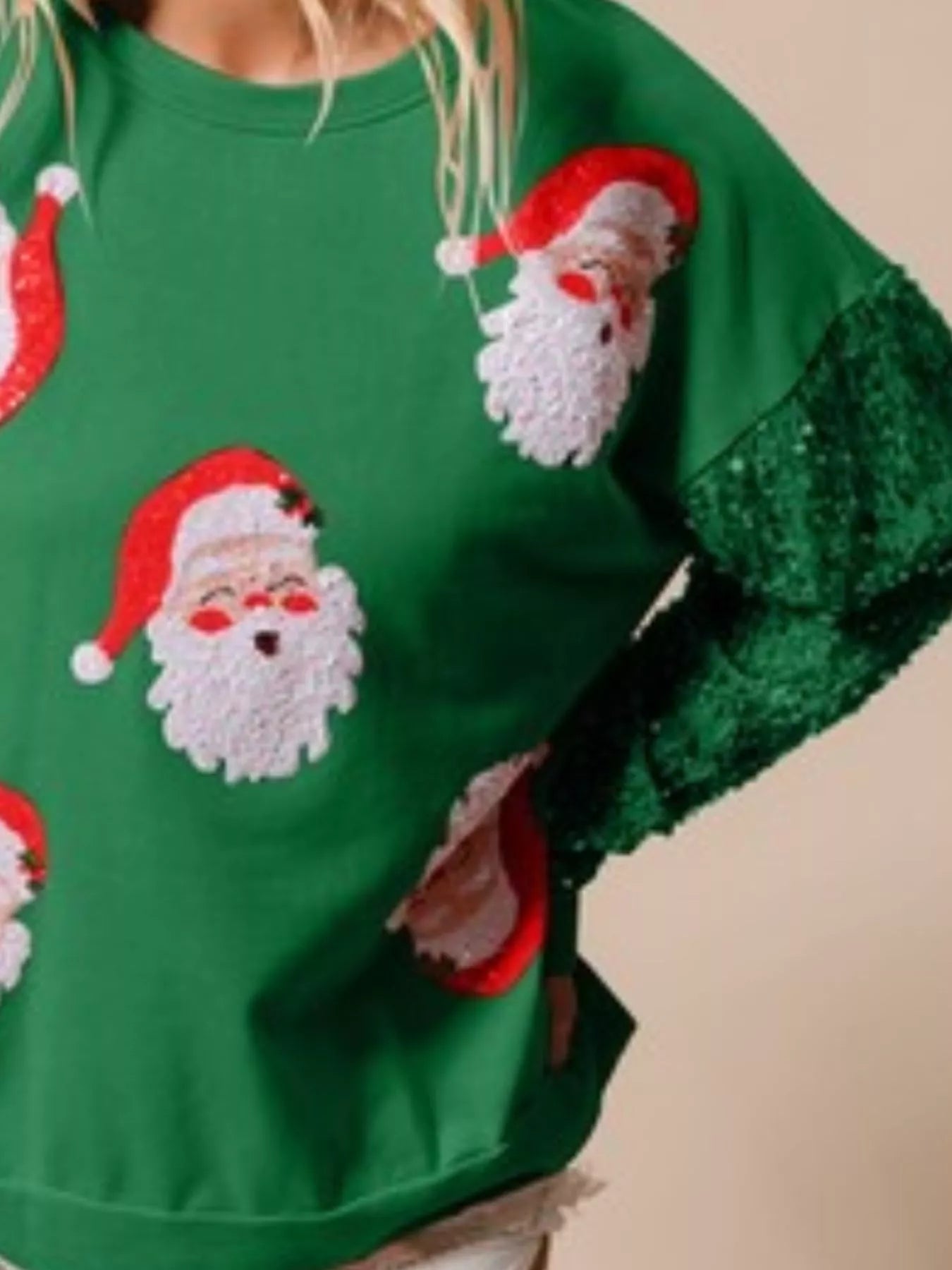 Long sleeve sweatshirt with sequins, designed for comfort and festive style.