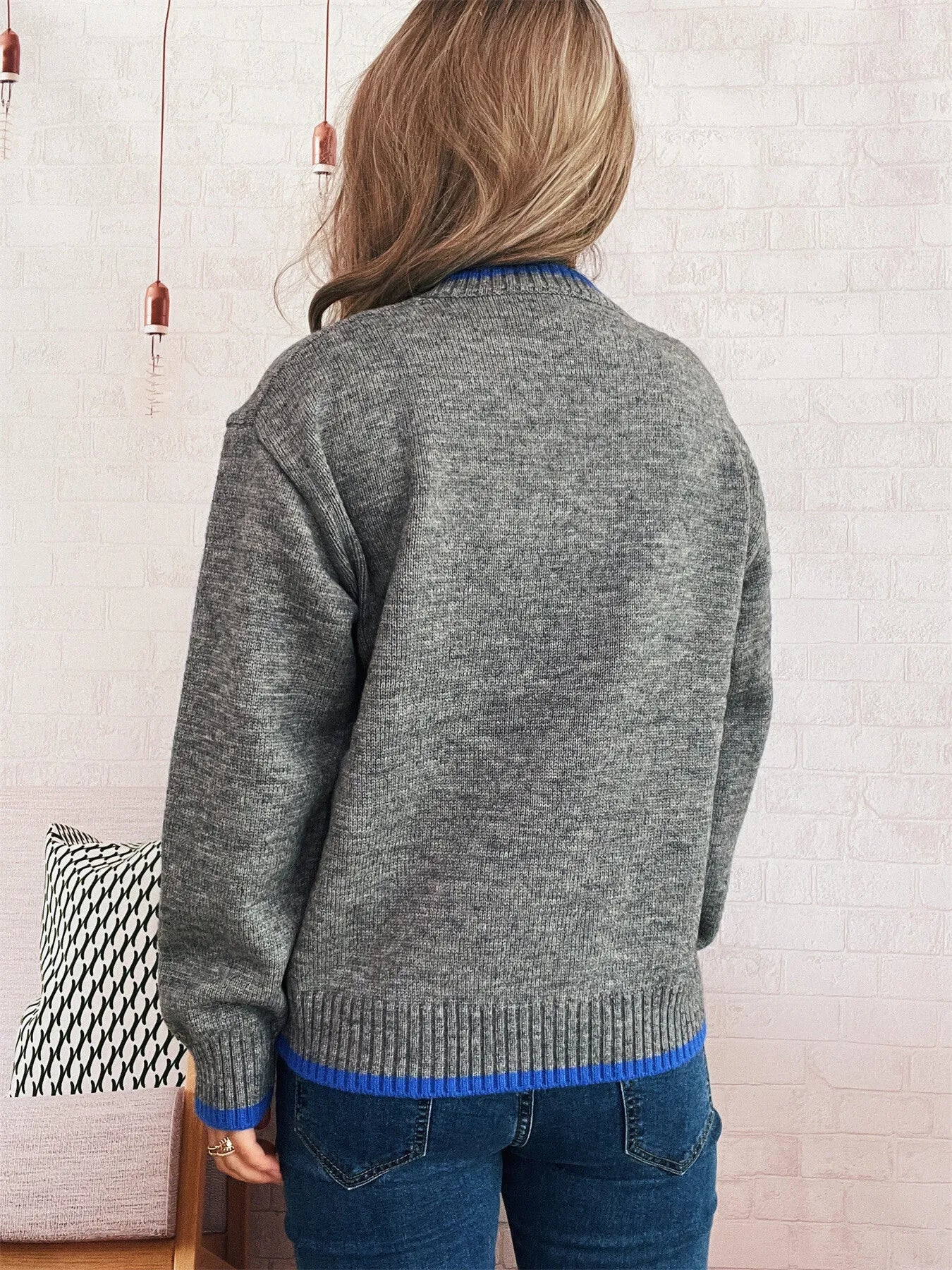 Ribbed long sleeve sweater with contrast trim, made of 100% polyester in a basic style.