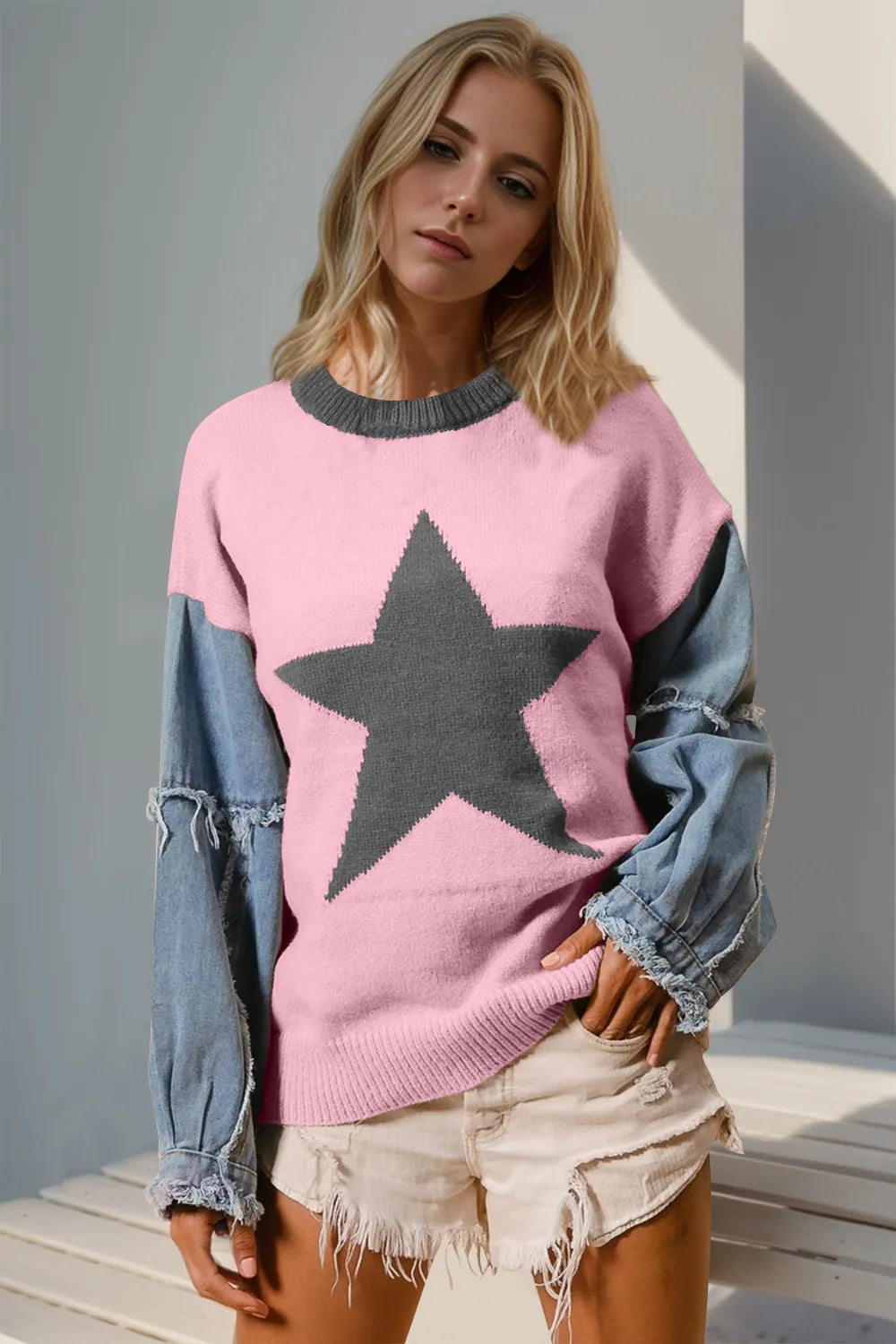 Long sleeve sweater with a raw edge and star pattern in a cotton blend fabric.