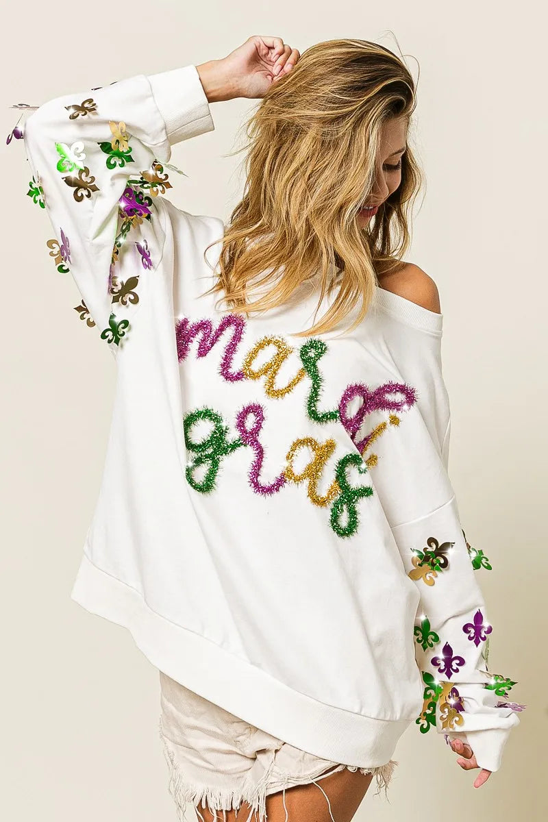 Lightweight pullover with Fleur De Lis designs on sleeves and relaxed fit for comfort.
